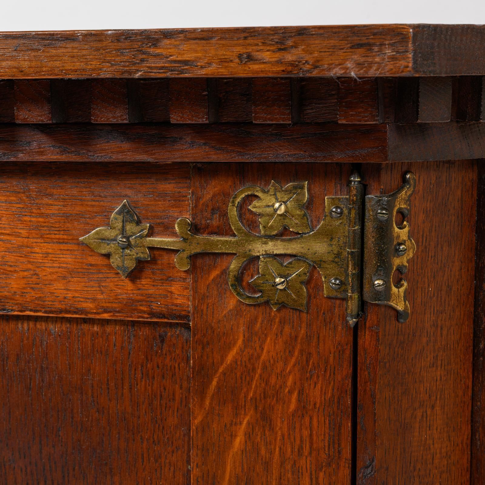 An Arts And Crafts Oak Corner Cabinet, Dated 1908, With The Crest Of The De Thorpe Family photo 280.0