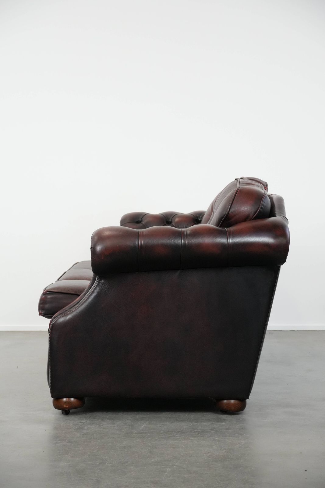 Beautiful Red 2.5 Seater Chesterfield Sofa On English Style Wheels Made Of Thick Cow Leather photo Furniture