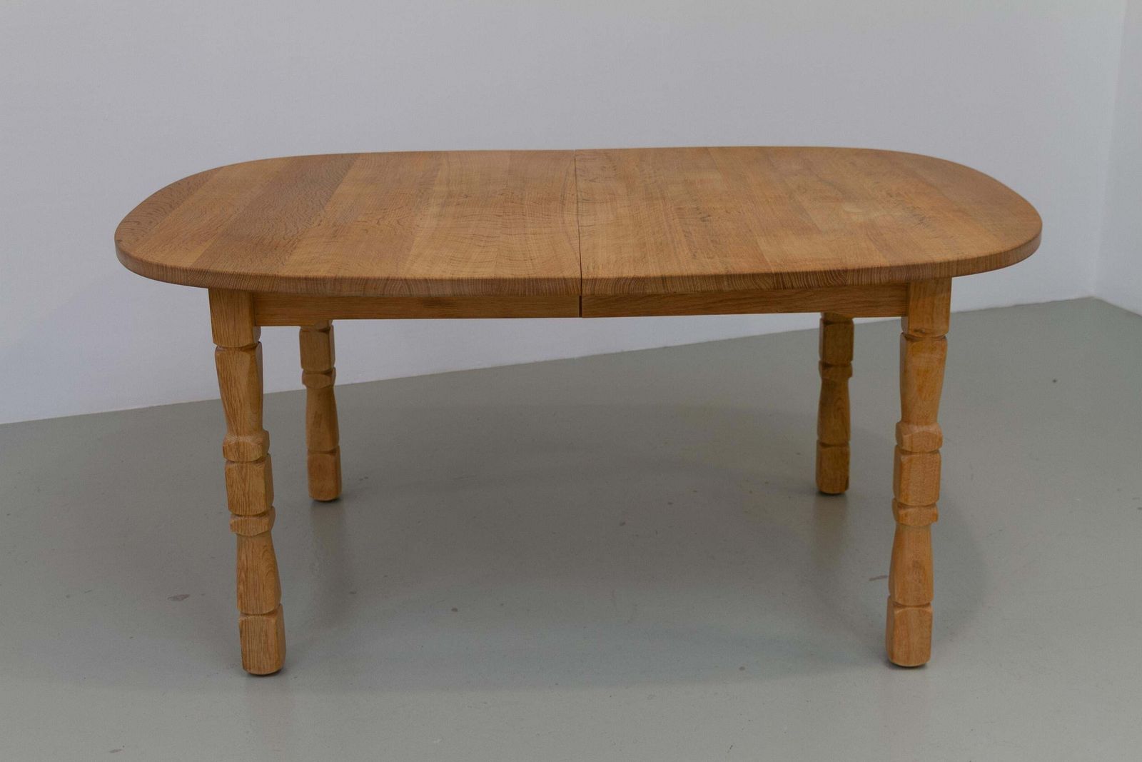 Danish Brutalist Oak Extendable Dining Table By Henning Kjærnulf, 1970s. photo for sale