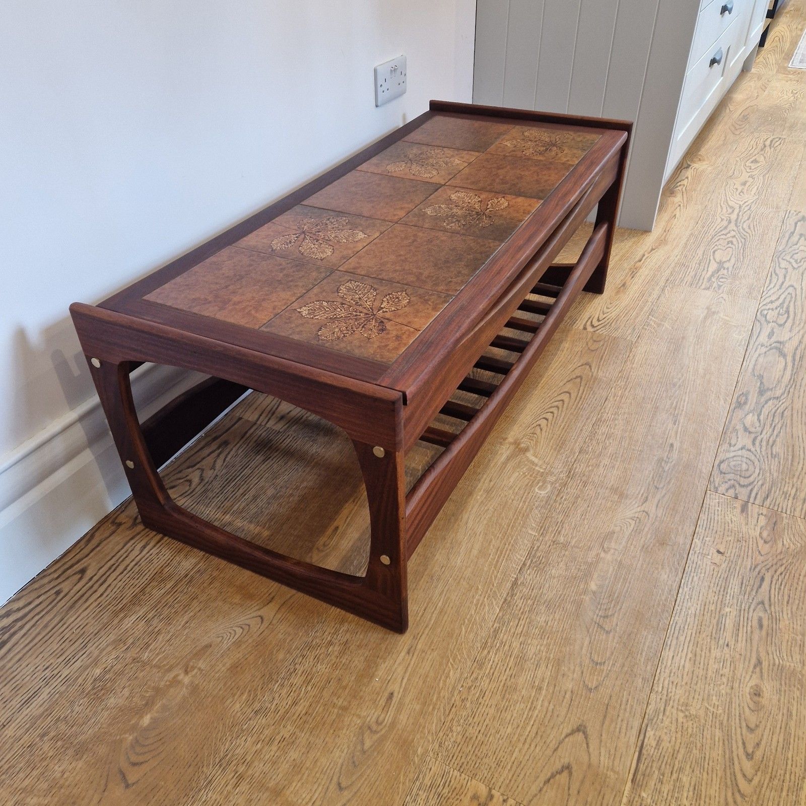Mid Century Solid Teak Coffee Table With Tiled Leaf Design And Slatted Shelf photo for sale