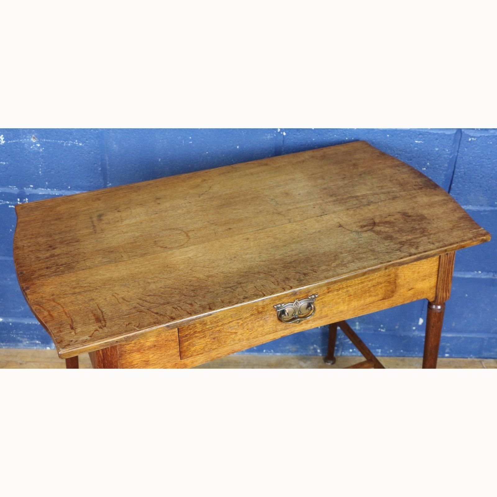 An Art Nouveau Oak Single Drawer Side Table Raised On Turned Angled Supports photo for sale