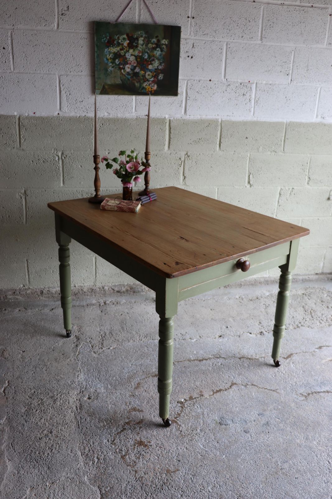 photo furniture Vintage Pine Farmhouse Table On Castors With Olive Green Paint Finish And Cutlery Drawer