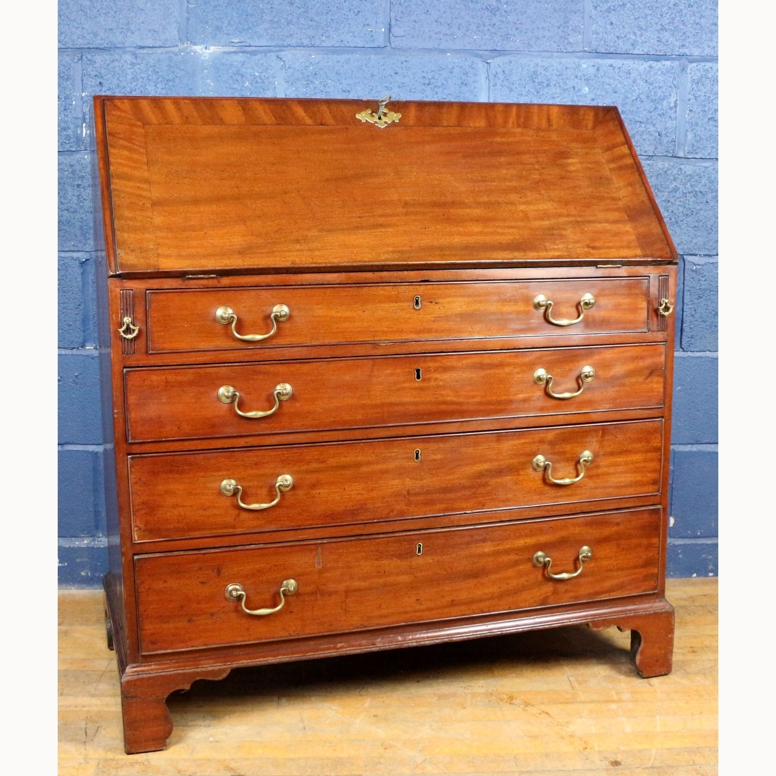 A Georgian Mahogany Fall Front Bureau With Fitted Interior Raised On Bracket Feet