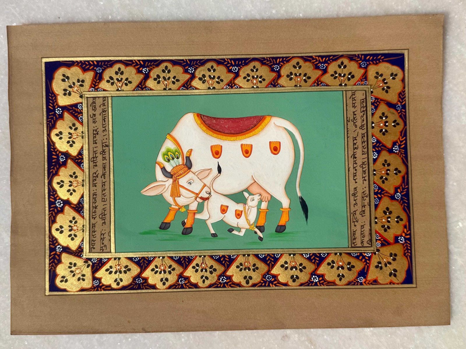 Hand Painted Miniature Sacred Cow & Calf On Antique Sanskrit Manuscript With Gold Border.