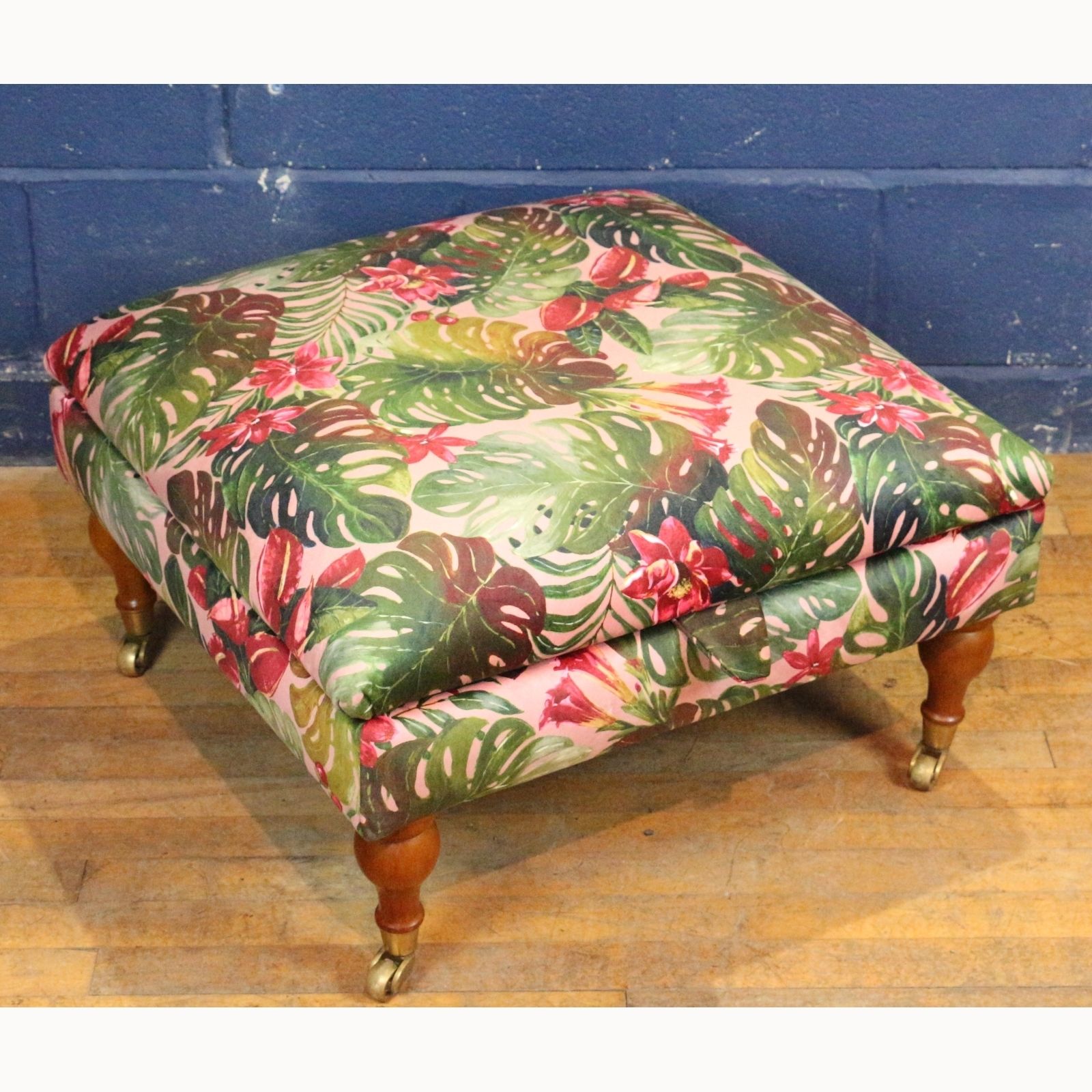 A Large Square Footstool Or Ottoman, Reupholstered In Stylised Material Raised On Turned Supports photo furniture