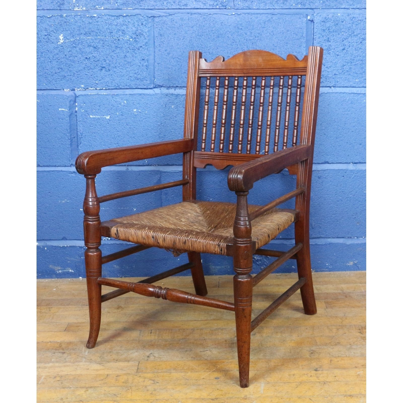 A Victorian Turned Mahogany And Rush Based Childs Low Open Armchair, Doll Or Teddy Display