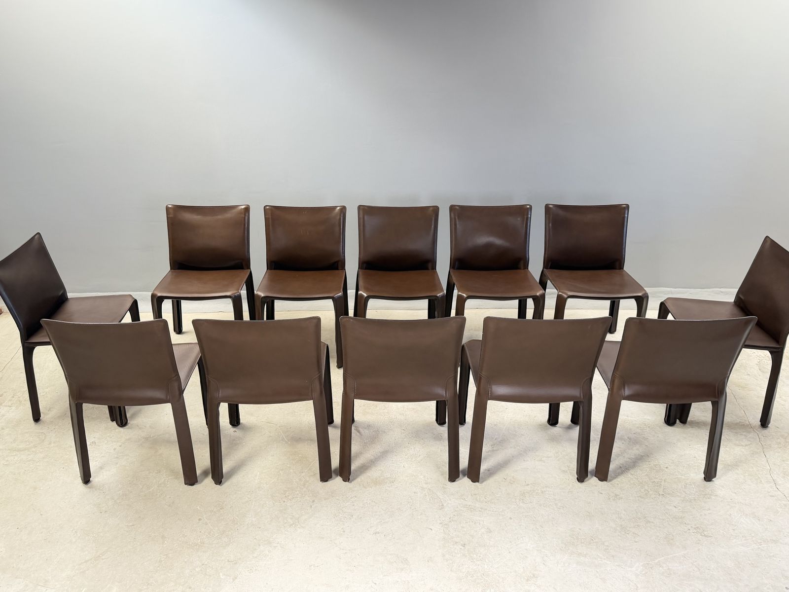 photo buy Mario Bellini Cab 412 Chairs For Cassina – Vintage Italian Saddle Brown Leather Dining Chairs – Set Of  12 Twelve Dining Chairs