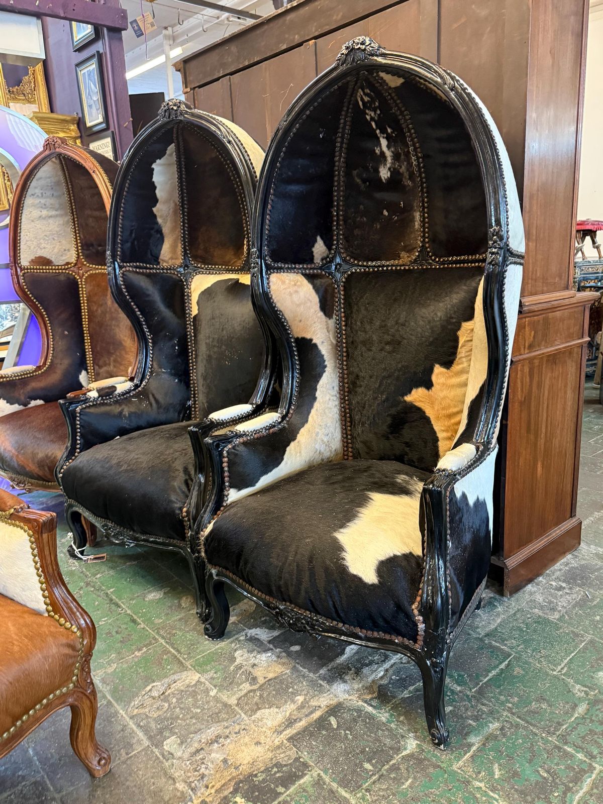 Continental Carved Cowhide Porters Chair. photo furniture