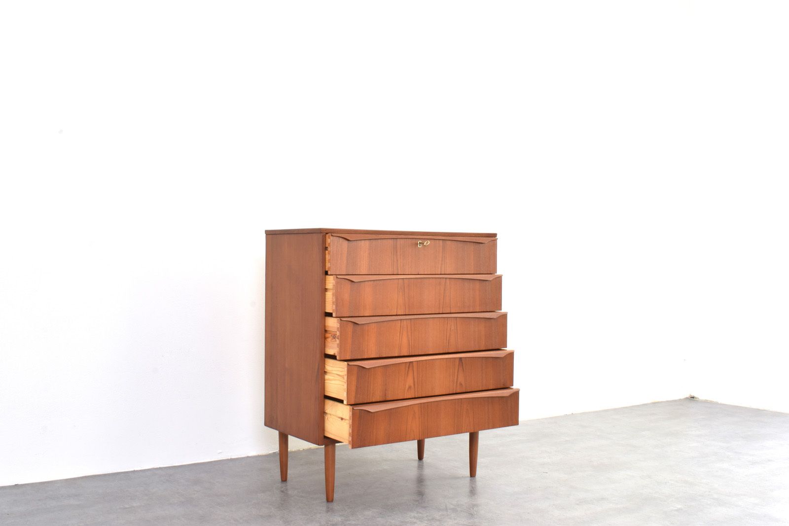 photo furniture Mid Century Danish Teak Chest Of Drawers, 1960s.