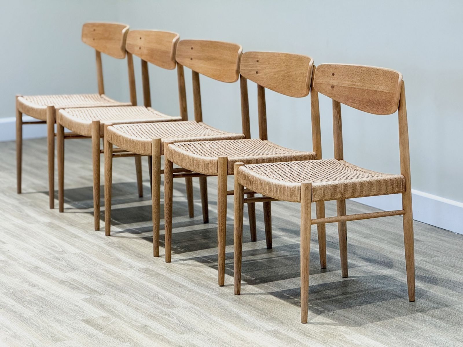 photo for sale Set Of Eight Oak A.M Møbler Model 501 Papercord Dining Chairs