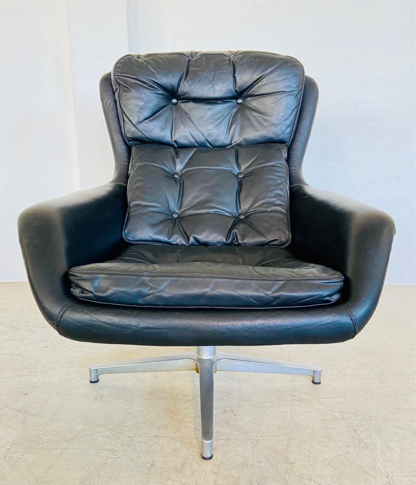 Vintage Danish Mid Century Black Leather Swivel Chair Manufactured By Dux For Alf Svensson.