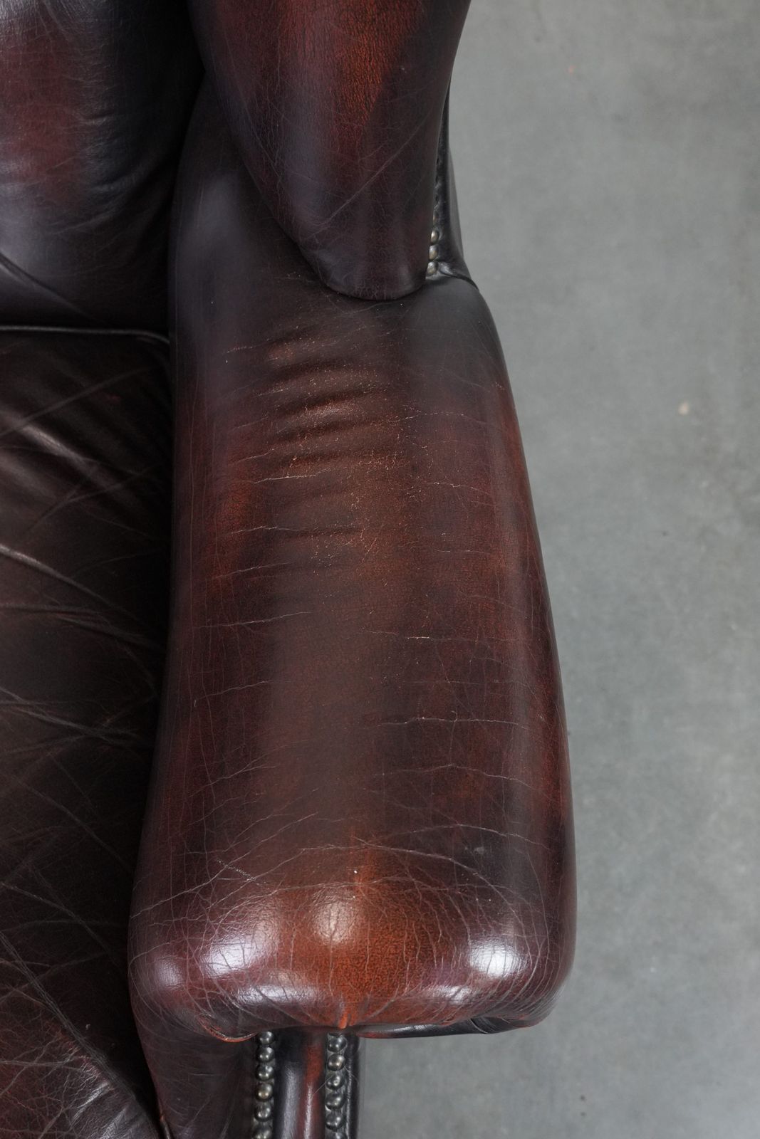 Beautiful, Luxurious, And Comfortable Brown Cowhide Chesterfield Wing Armchair In A Classic English Style. photo vintage
