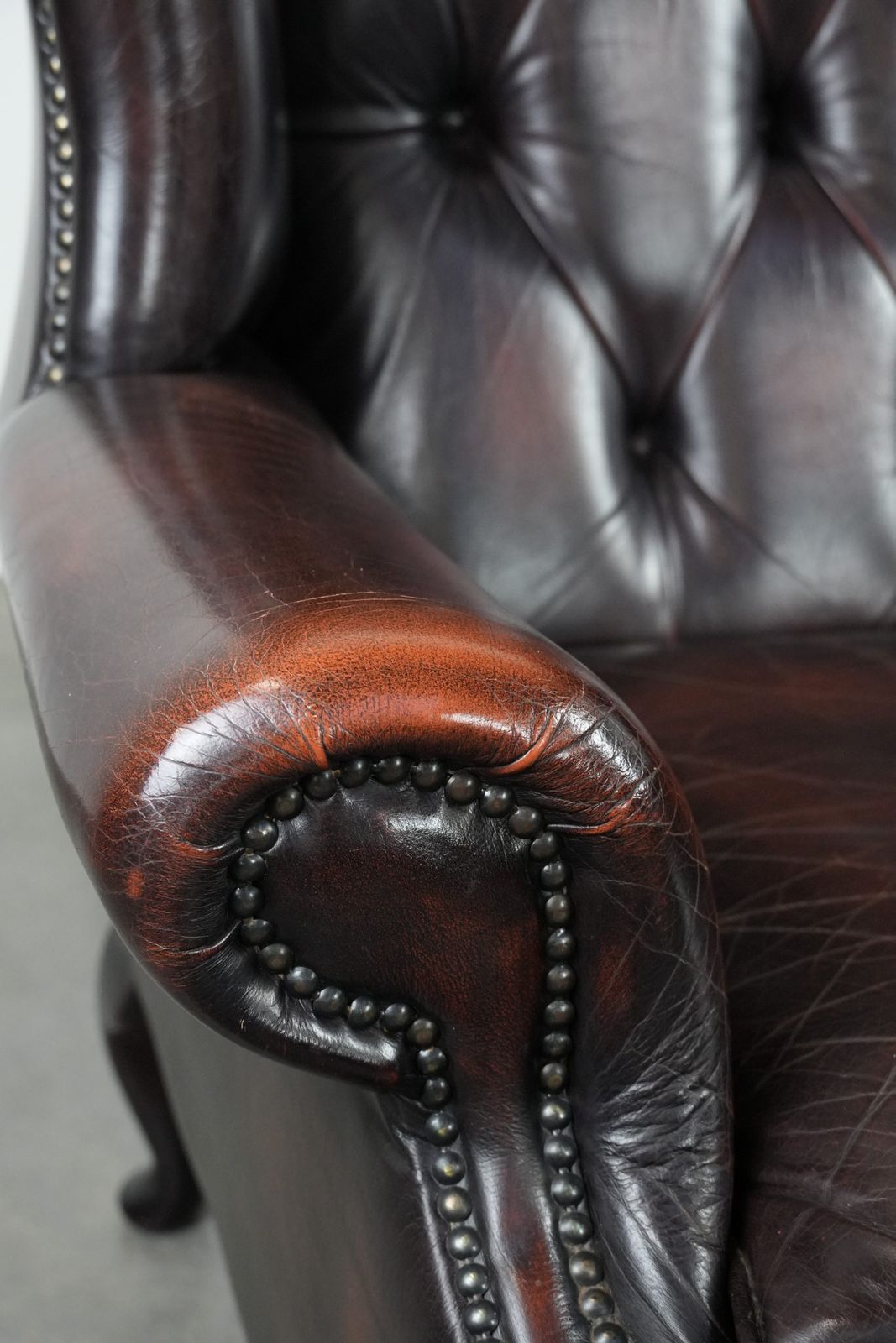 photo for sale Beautiful, Luxurious, And Comfortable Brown Cowhide Chesterfield Wing Armchair In A Classic English Style.