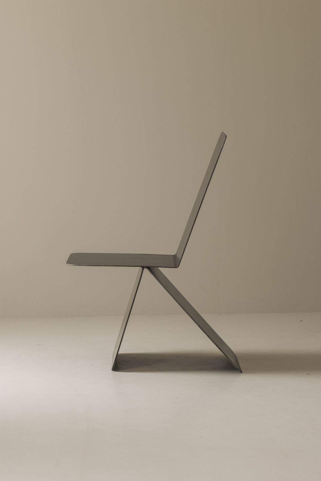 Striking Modernist Metal Chair From The 1980s, Executed In Folded Sheet Steel. photo vintage