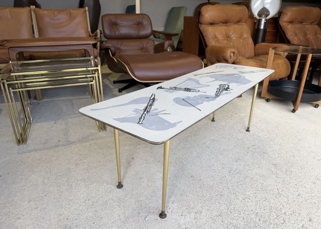 Retro Mid Century Coffee Table With Various Music Instruments On Top 1960s photo furniture