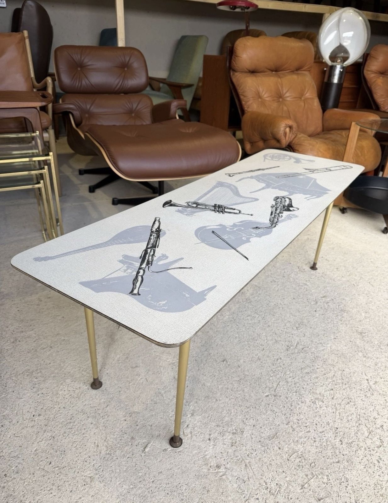 Retro Mid Century Coffee Table With Various Music Instruments On Top 1960s photo for sale