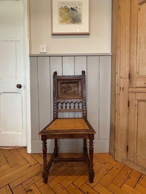 Oak Chair With Canework Seat And Carved Tavern Scene Of Back Panel