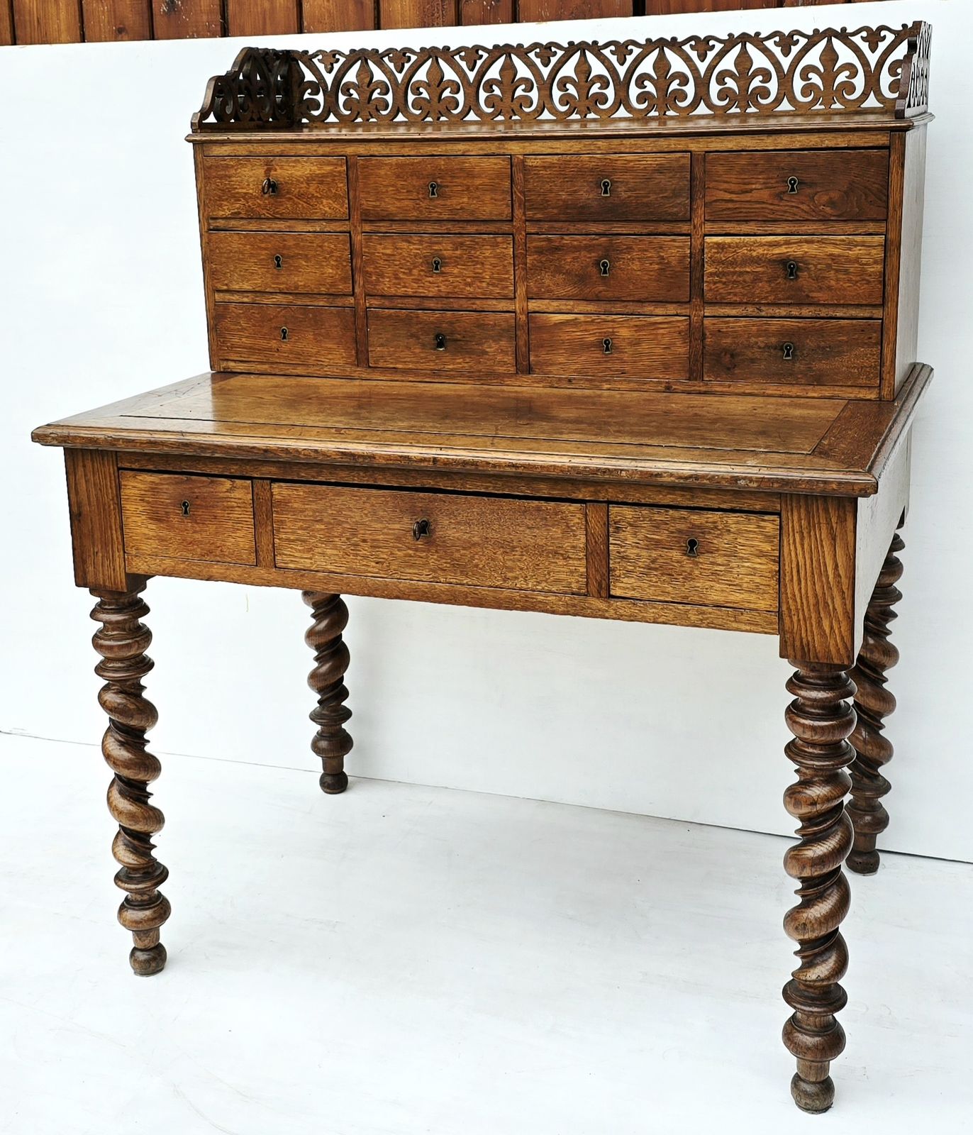 Antique French Oak Notaire's Desk With Bank Of Lockable Drawers & Carved Fretwork. photo for sale