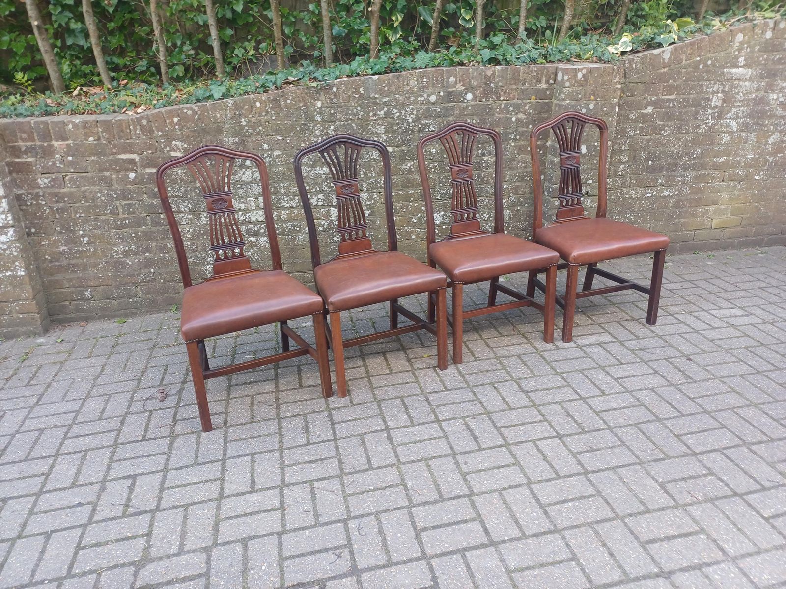 595.0 Set Of Four Vintage 1920s Mahogany Dining Chairs With Carved Backs And Brown Vinyl Seats photo