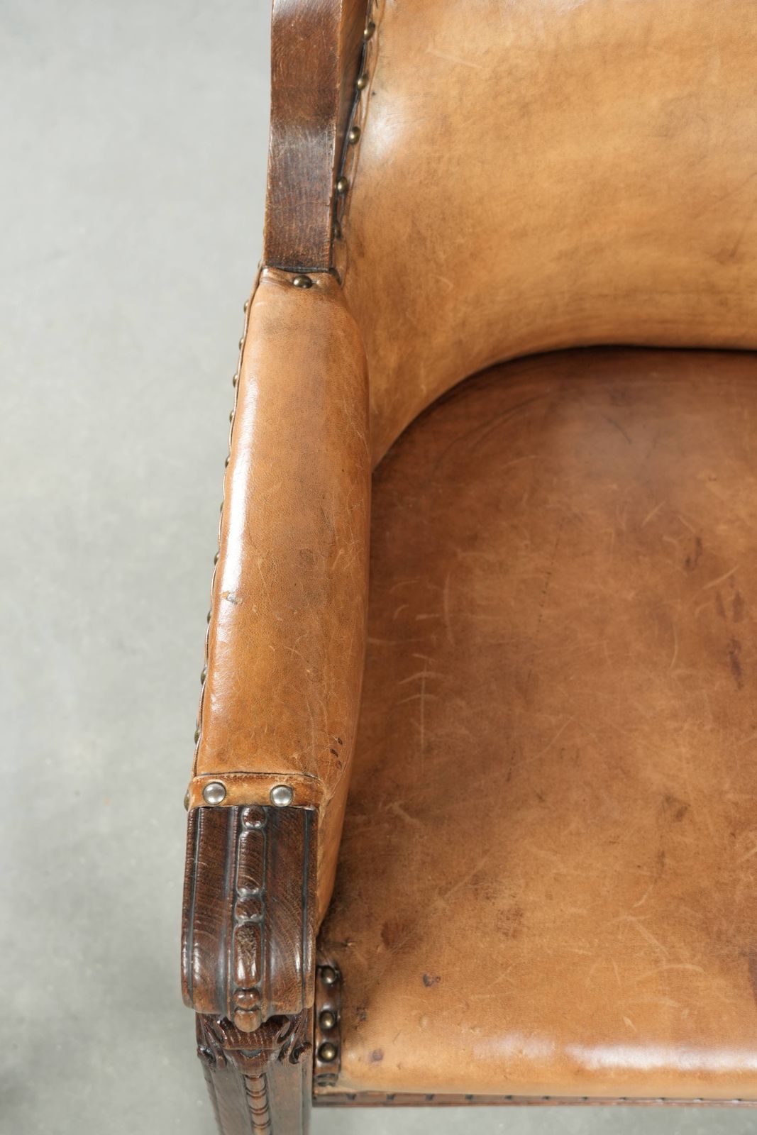Antique Armchair Of Sheepskin And Wood With Decorative Nails And Beautiful Woodwork photo buy