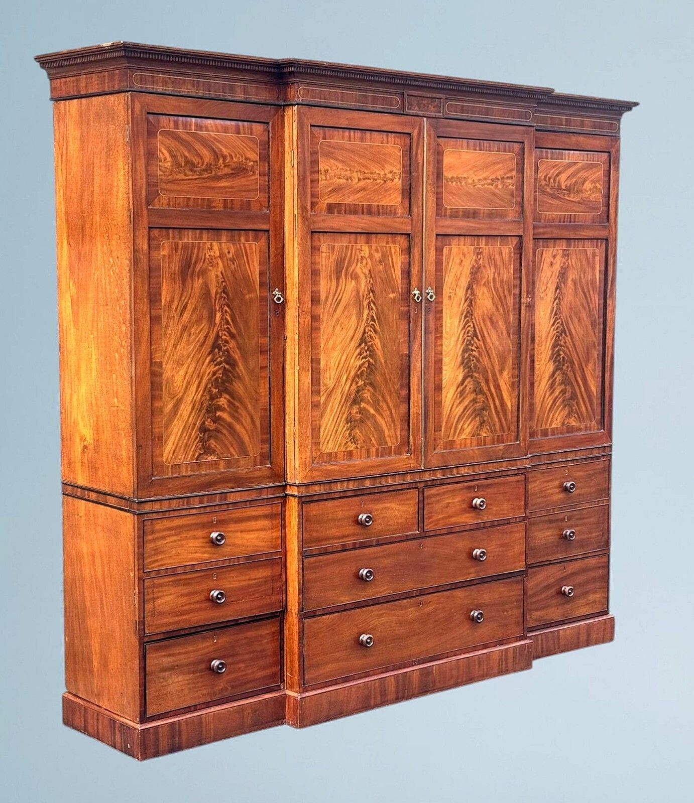 A Large Regency Figured Mahogany Breakfront Wardrobe With Brass Inlaid Decoratio photo for sale