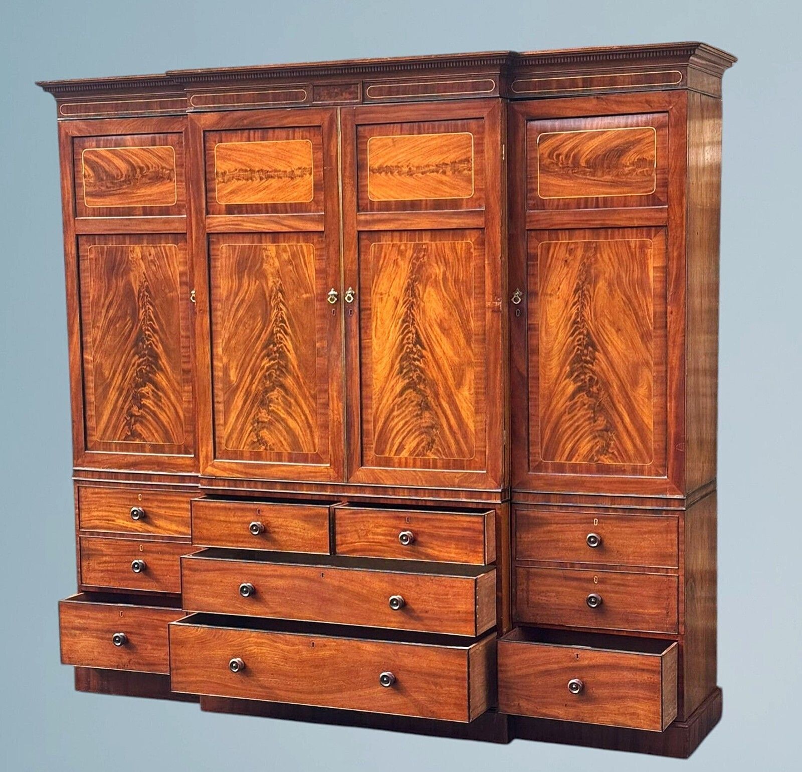 1725.0 A Large Regency Figured Mahogany Breakfront Wardrobe With Brass Inlaid Decoratio photo