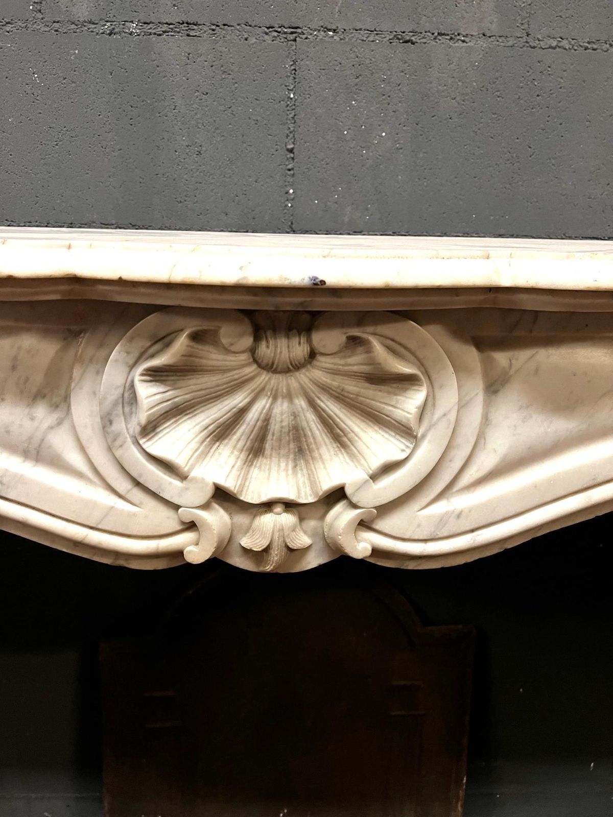 photo furniture Fireplace Frame Made Of White Stained Marble Italy