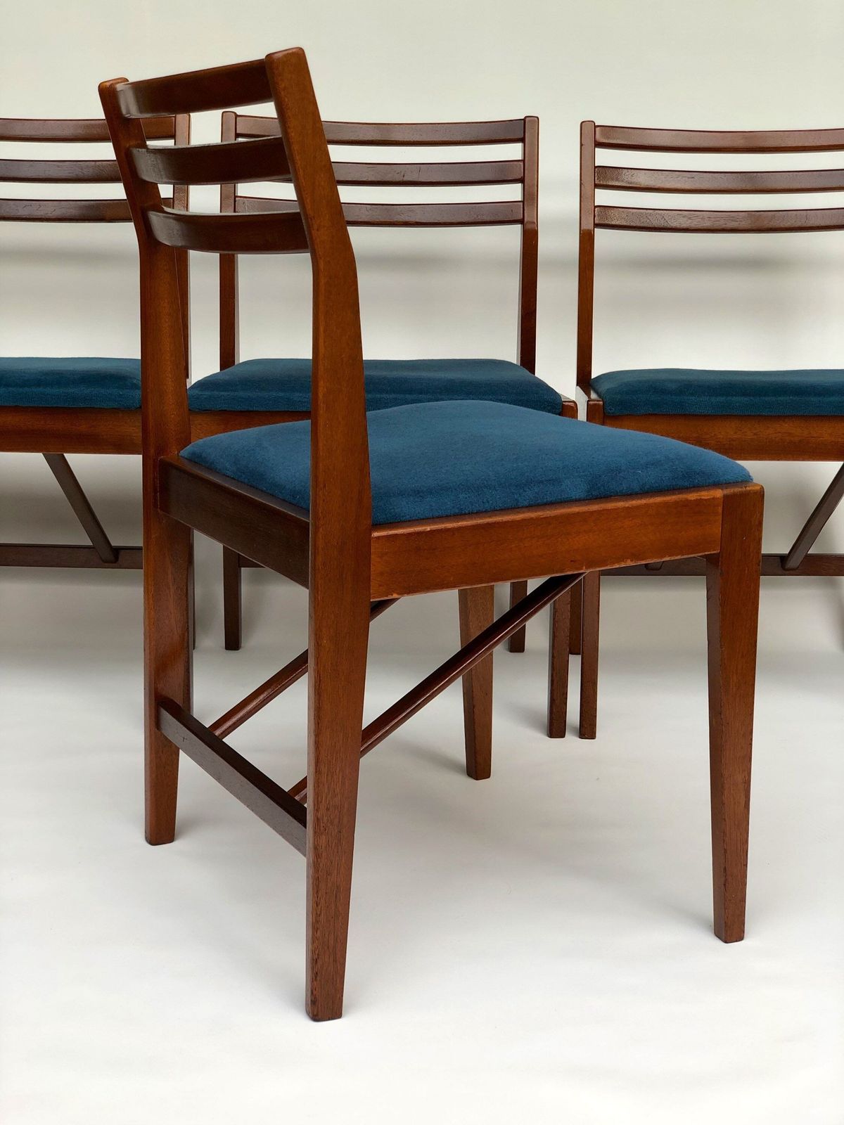 photo furniture Danish Mcm Set Of 4 Teak Chairs 1970s With Blue Upholstered Seat Pad