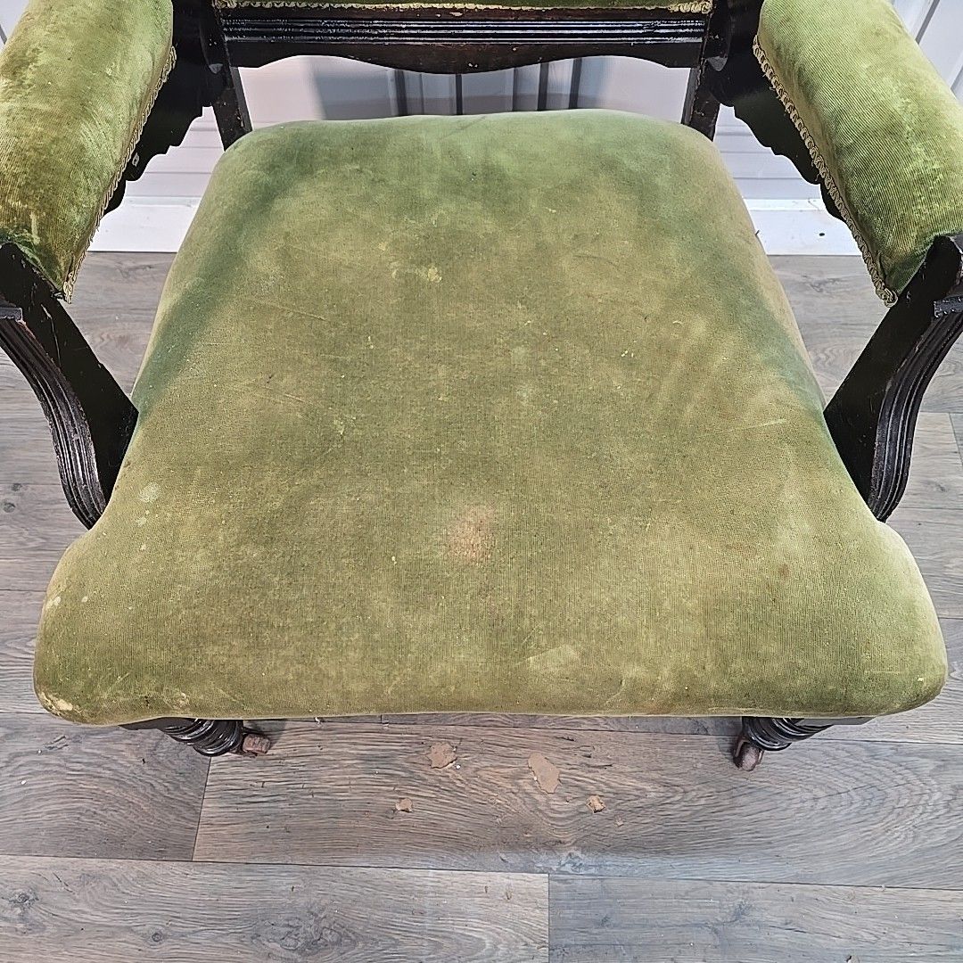 photo furniture Antique Armchair Carved Wood Upholstered Elbow Chair Castors Victorian Vintage