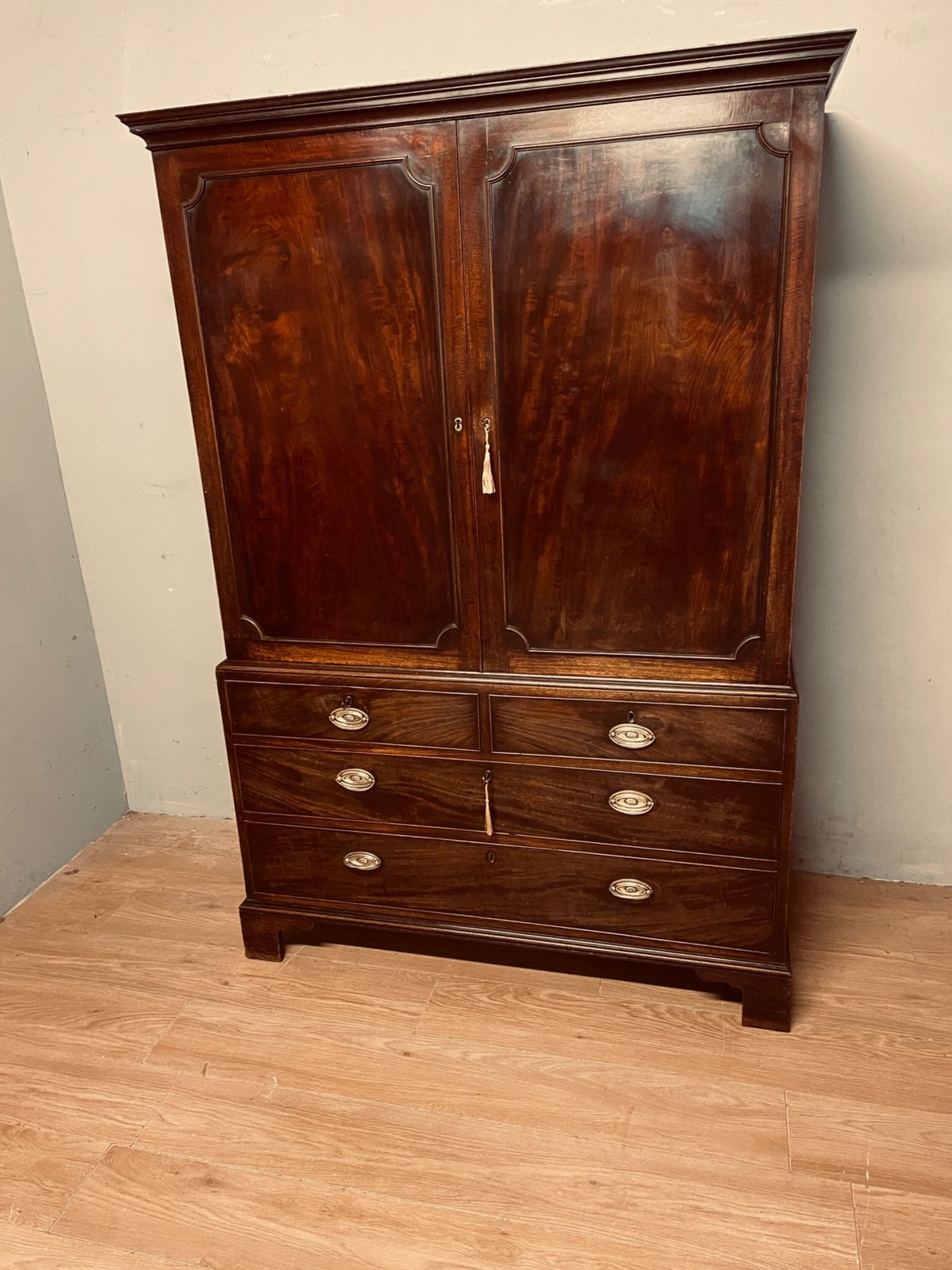 photo for sale Georgian Flame Mahogany Linen Press Of Small Proportions