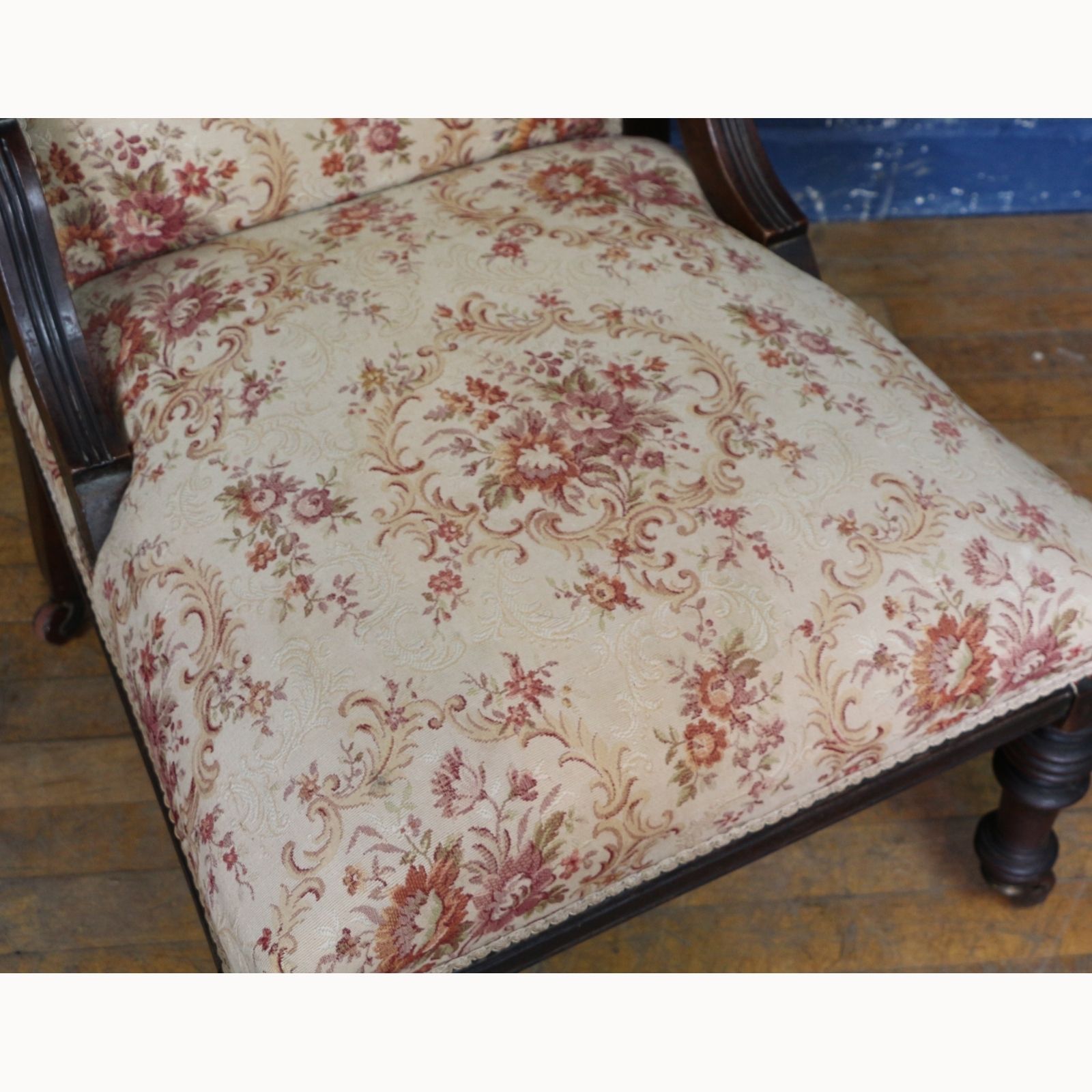 A Victorian Carved Walnut Framed Fireside Chair Raised On Turned Supports photo for sale