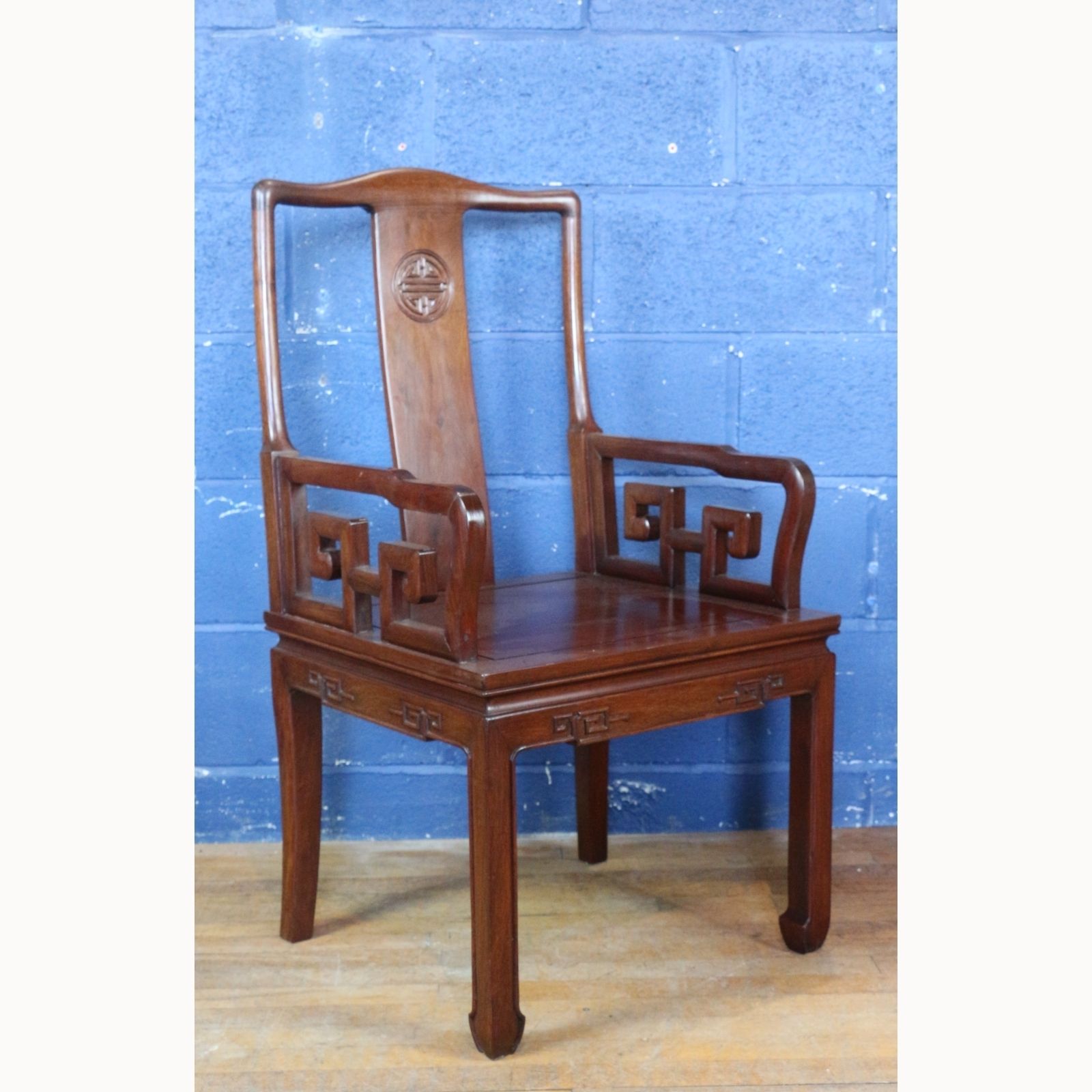 A C20th Carved Chinese Hardwood Open Arm Chair