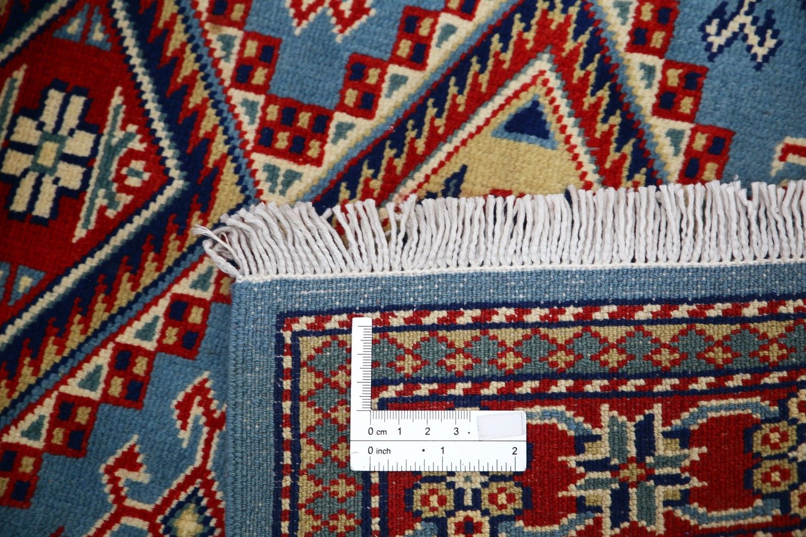 Tapis d'accent en laine fait main, bleu, rouge et ivoire, motif médaillon géométrique, 60 x 90 cm photo buy