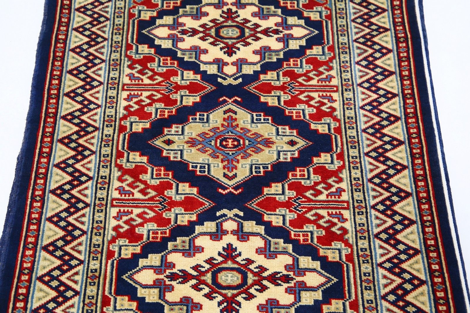 Tapis d'appoint noué à la main, bleu marine, rouge et ivoire, motif médaillon géométrique, 67 x 92 cm photo 370.0