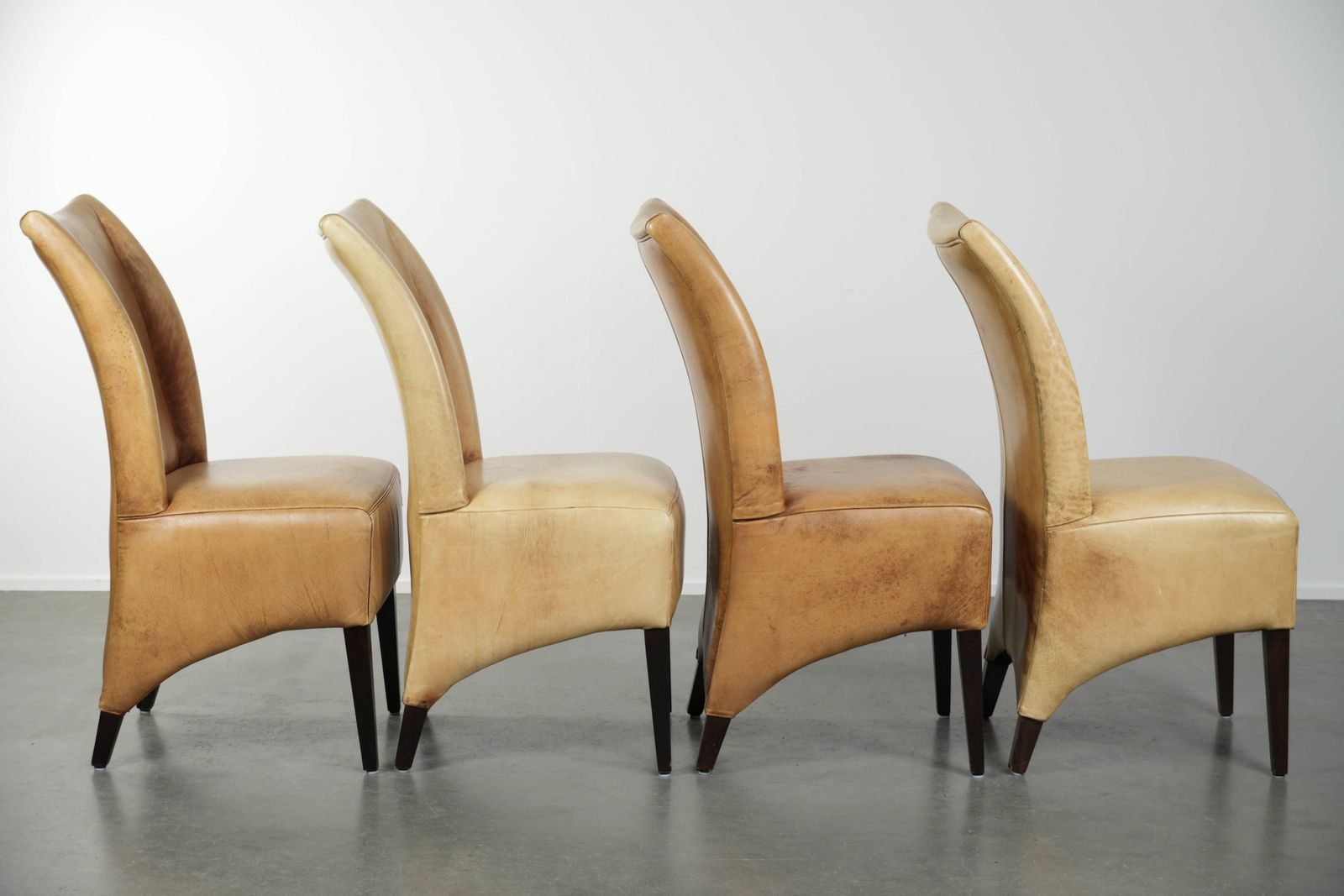 Luxury Set Of Four Cowhide Leather Dining Chairs With A Beautiful Light Color, Comfortable Seat, And A High Back photo for sale