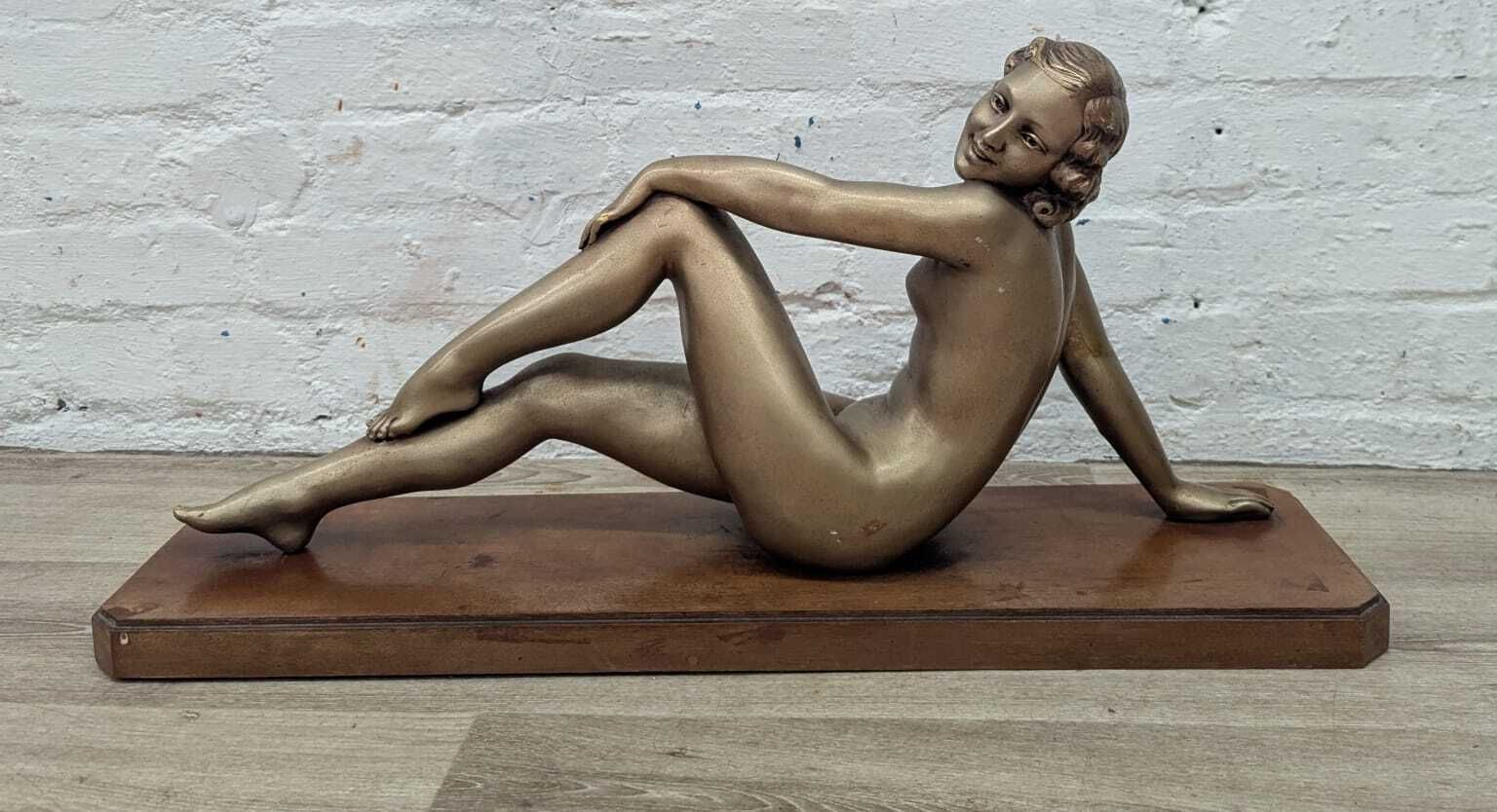Early 20th Century French Art Deco Reclining Nude Figure On Wooden Plinth