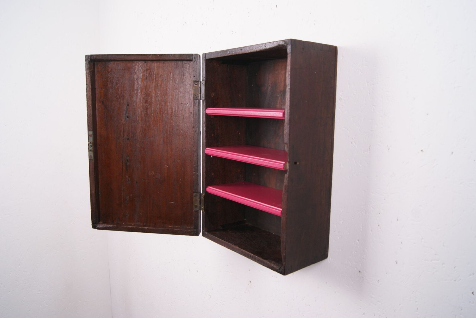 Wooden Wall Cabinet With Pink Shelves photo vinterior