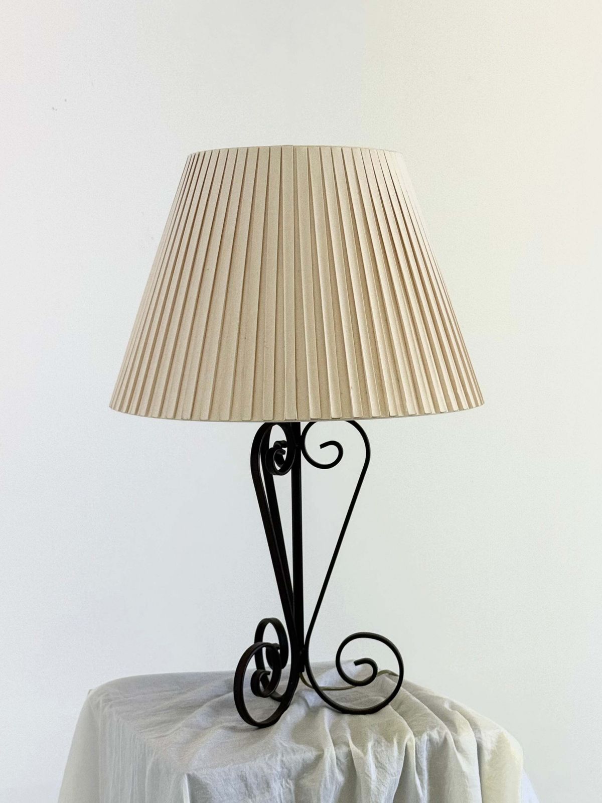 Vintage Wrought Iron Table Lamp In A Swirl Shape With A Pleated Shade photo Lighting