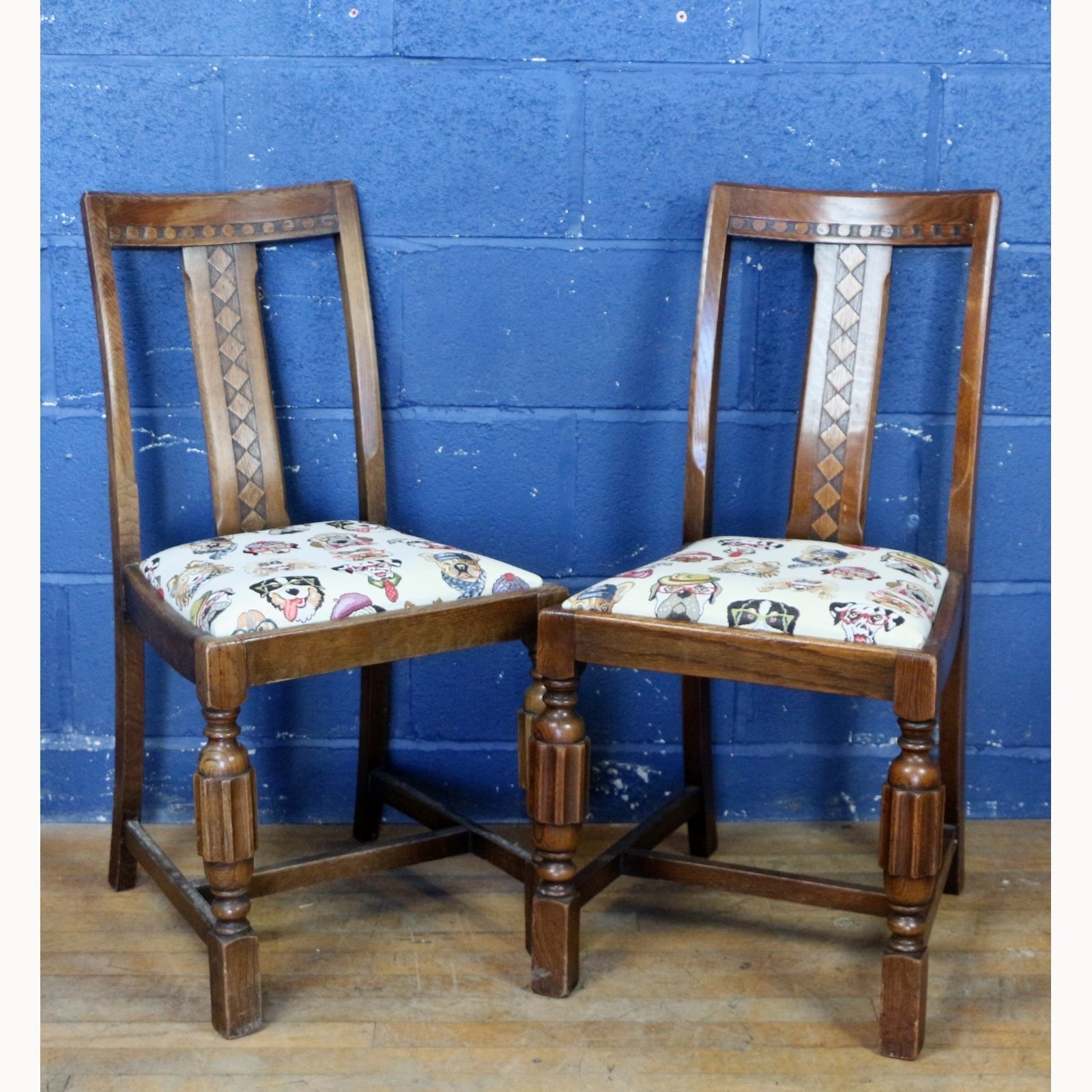 A Set Of Four 1950s Carved Oak Dining Chairs Freshly Reupholstered With Stylised Dog Faces photo for sale