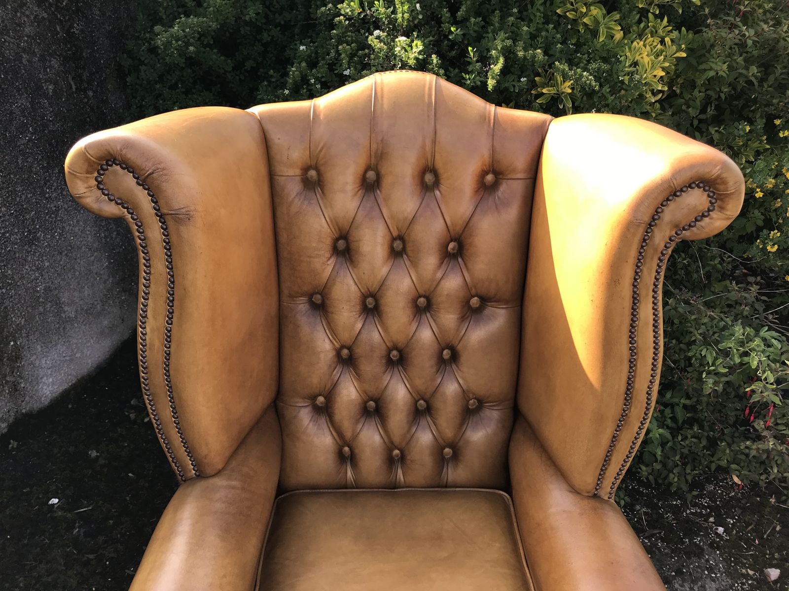photo furniture Vintage Hand Dyed Ochre Leather Chesterfield Wing Armchair