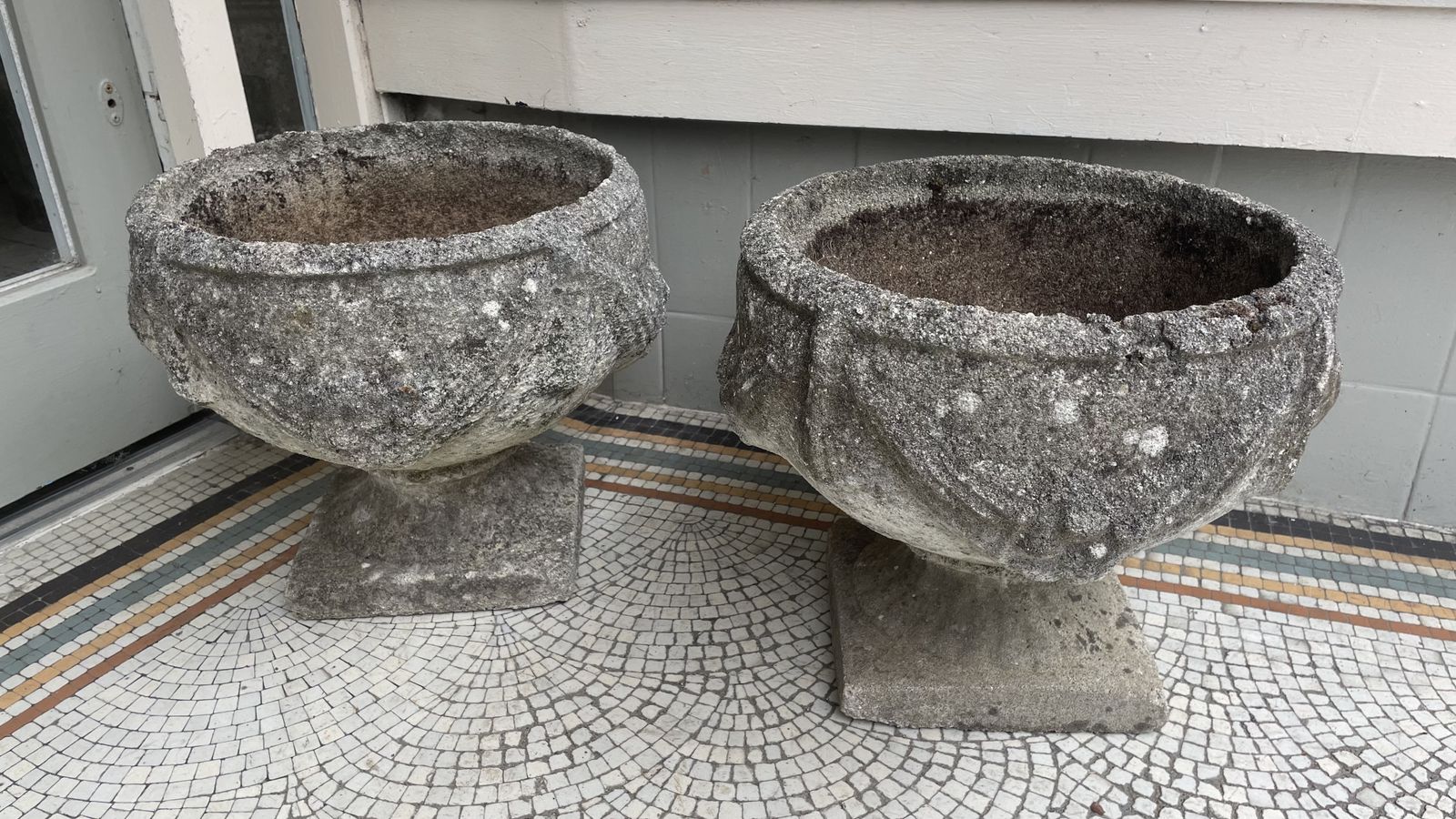 Antique Pair Of Weathered Garden Footed Swag Urns