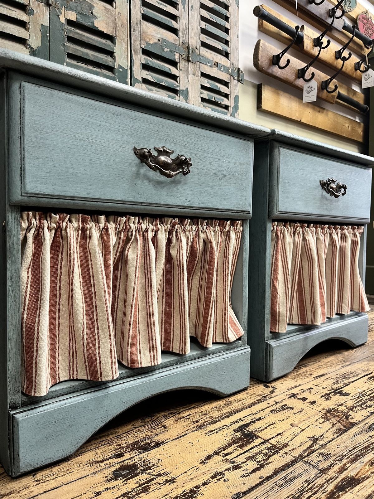 Pair Of Blue Bedside Tables With Striped Cafe Curtains photo for sale