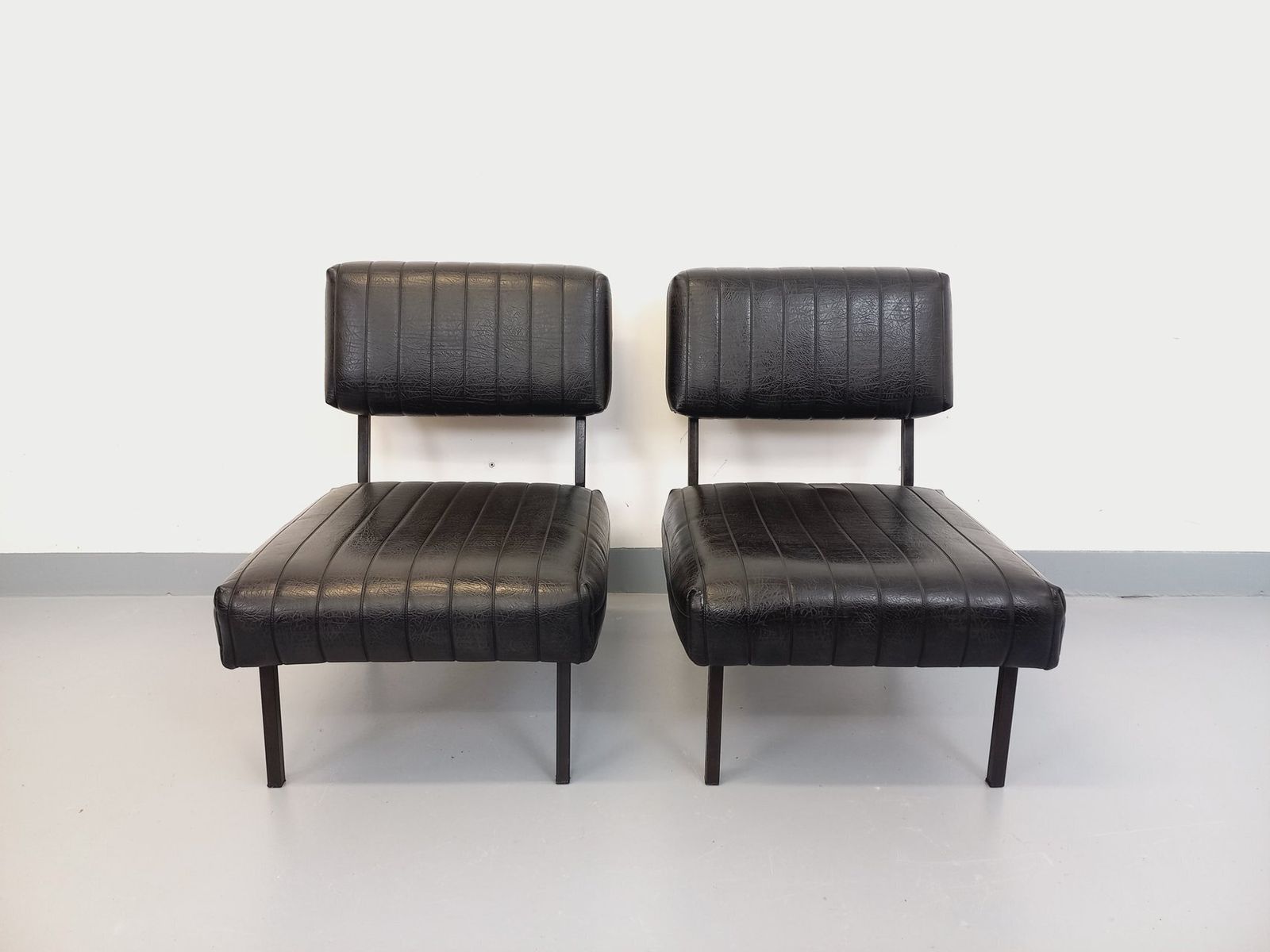 2 Modernist Armchairs In Black Imitation Leather And Metal photo furniture