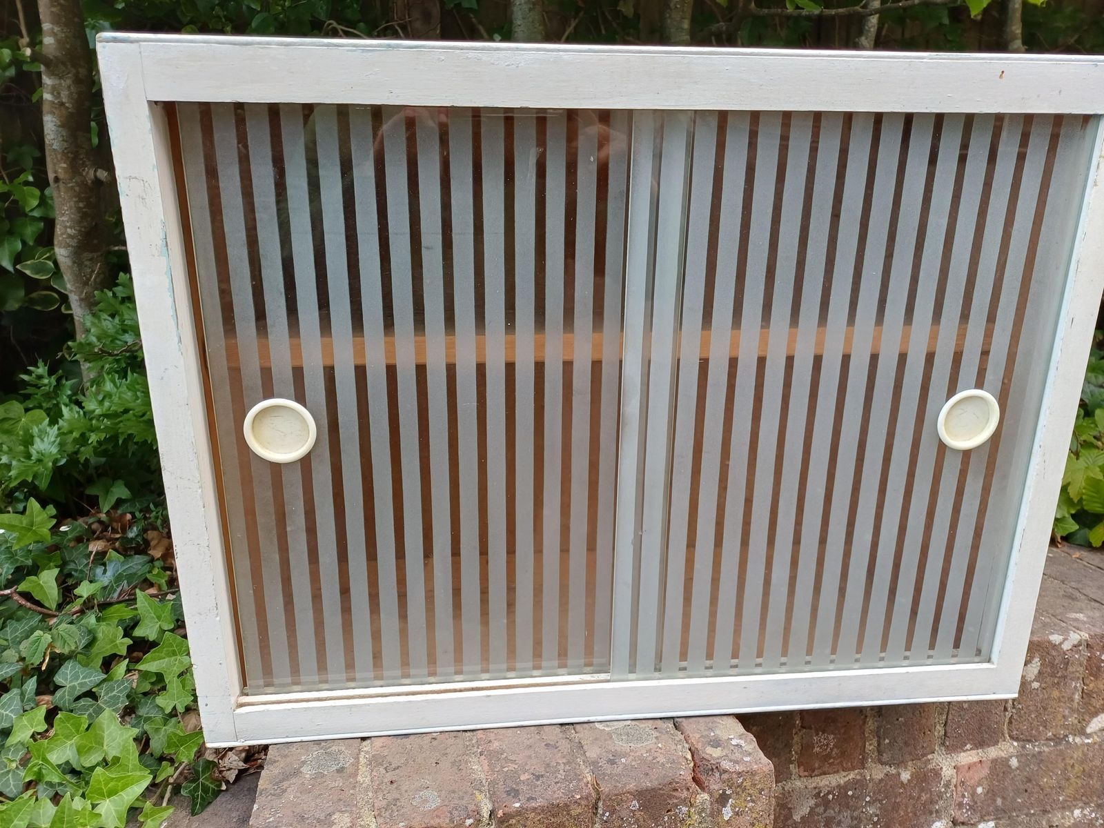photo vinterior 1950s Painted Kitchen Bathroom Wall Cupboard With Sliding Ribbed Glass Doors Mid Century Utility Storage Cabinet