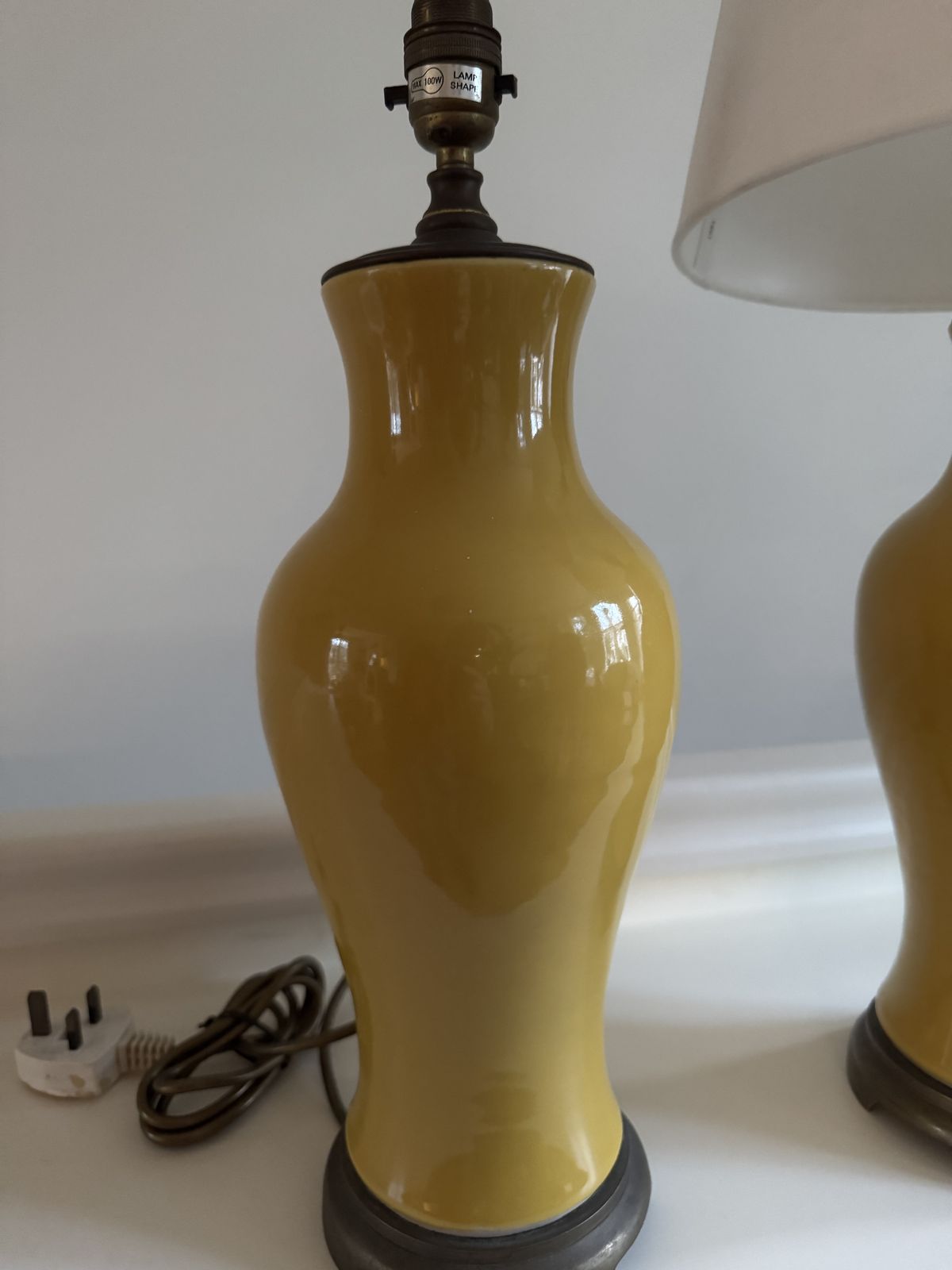 A Pair Of Pale Yellow Porcelain And Brass Tablelamps photo furniture
