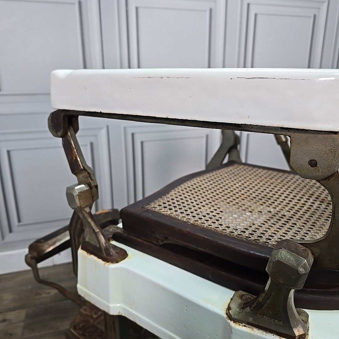 photo vintage Antique Triumph Barbers Chair Cast Iron & Cane Display Tattoo Barber
