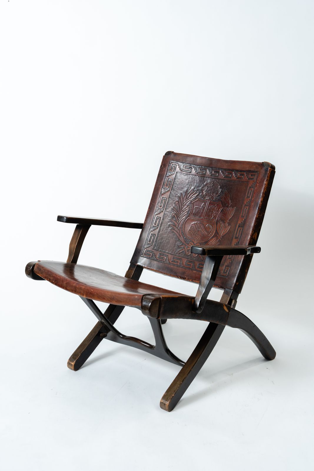 Angel Pazmiño – Hand Carved Crested Leather And Hardwood Folding Armchair/Chair (1960s–70s)