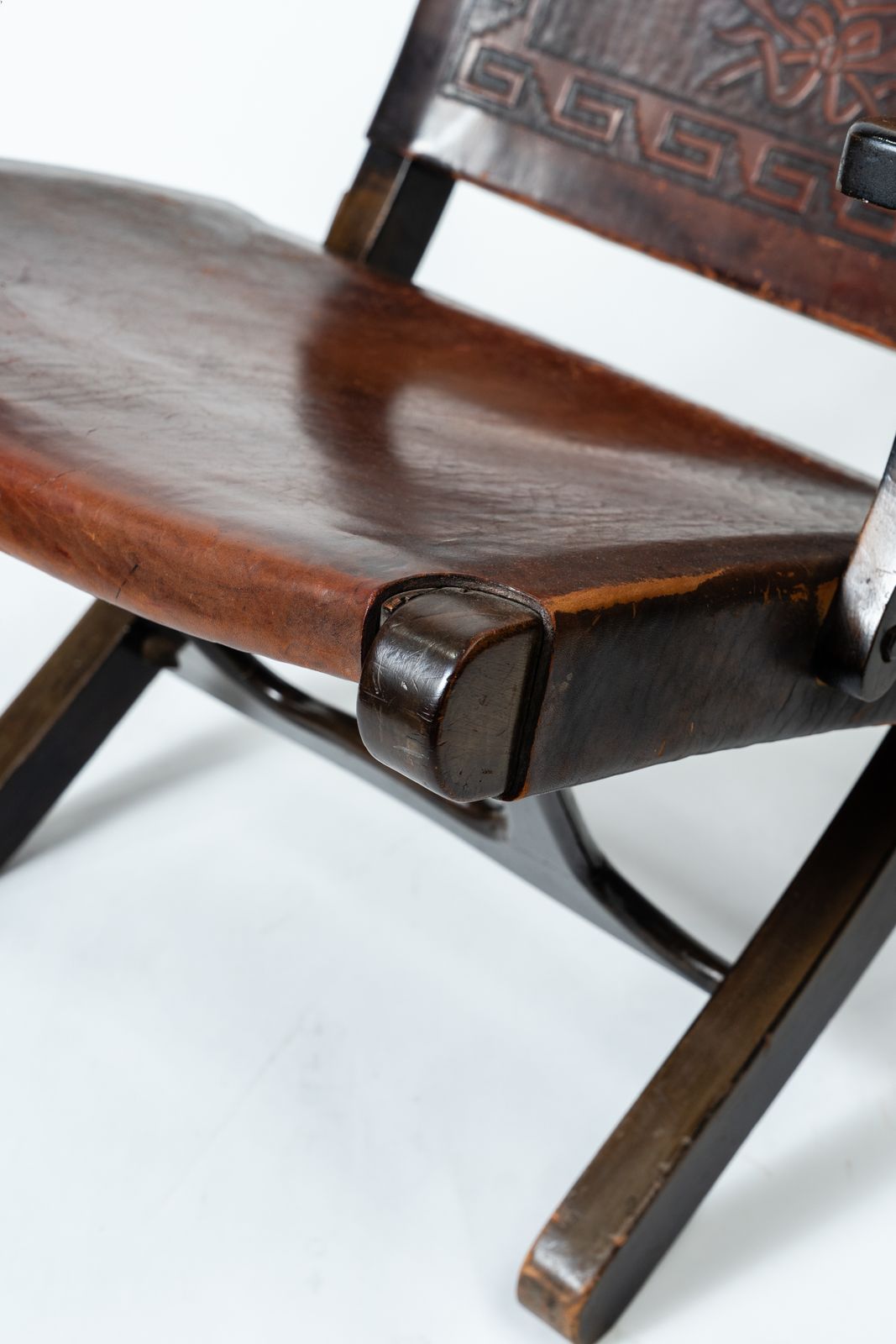 Angel Pazmiño – Hand Carved Crested Leather And Hardwood Folding Armchair/Chair (1960s–70s) photo for sale