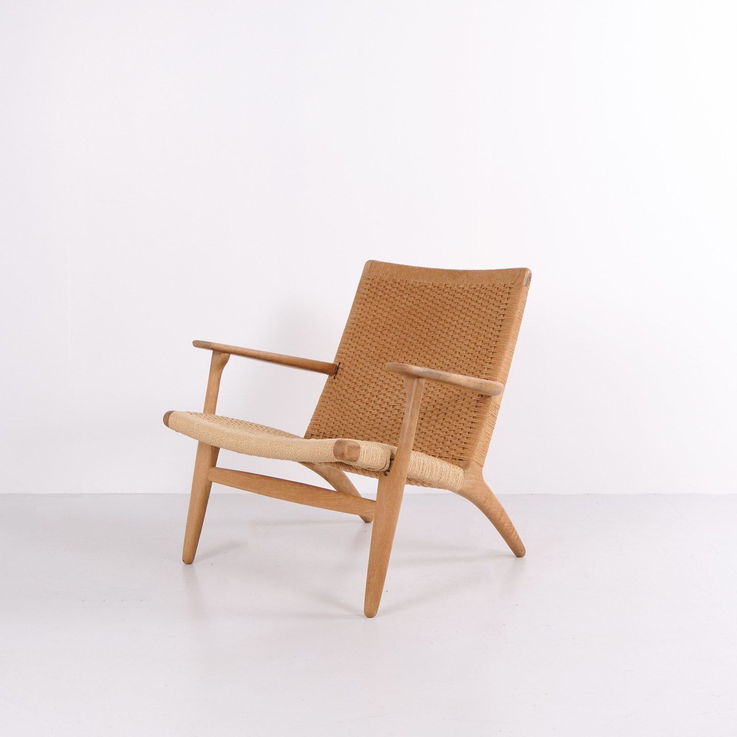 Ch25 Lounge Chair In Patinated Solid Oak And Woven Paper Cord By Hans J. Wegner photo furniture