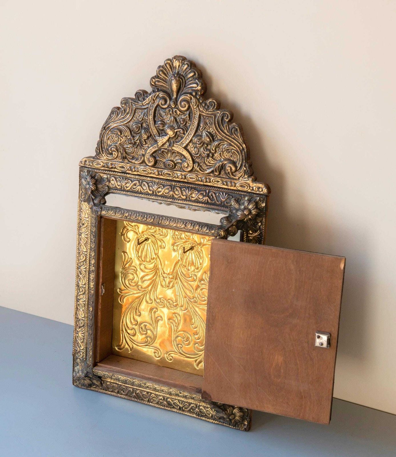 photo furniture Antique French Brass Mirror With Floral Crest – Ornate Repoussé Vanity Cabinet